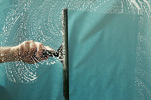 Cleaning a glass screen.